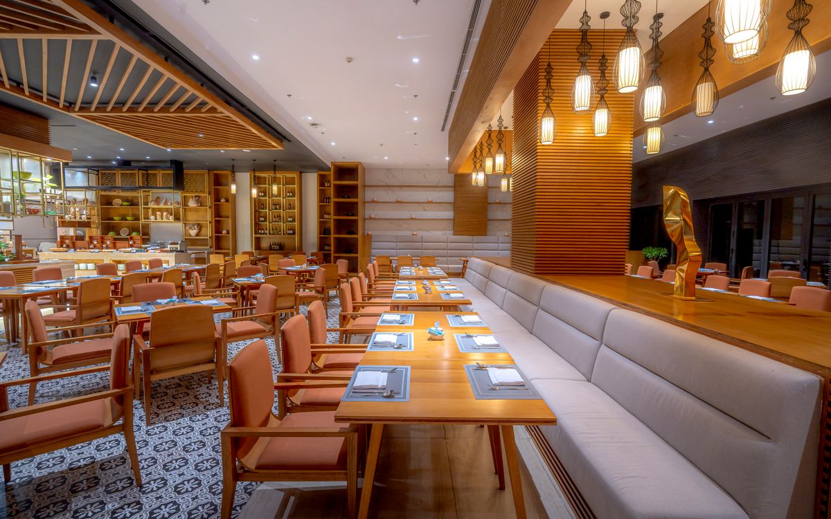 Restaurant interior with warm pendant lighting and timber finishes
