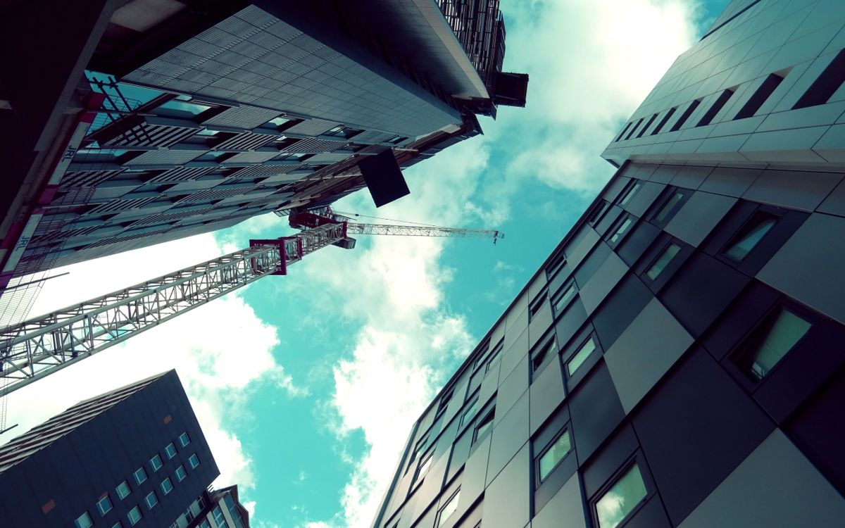 Tower cranes over a city construction site